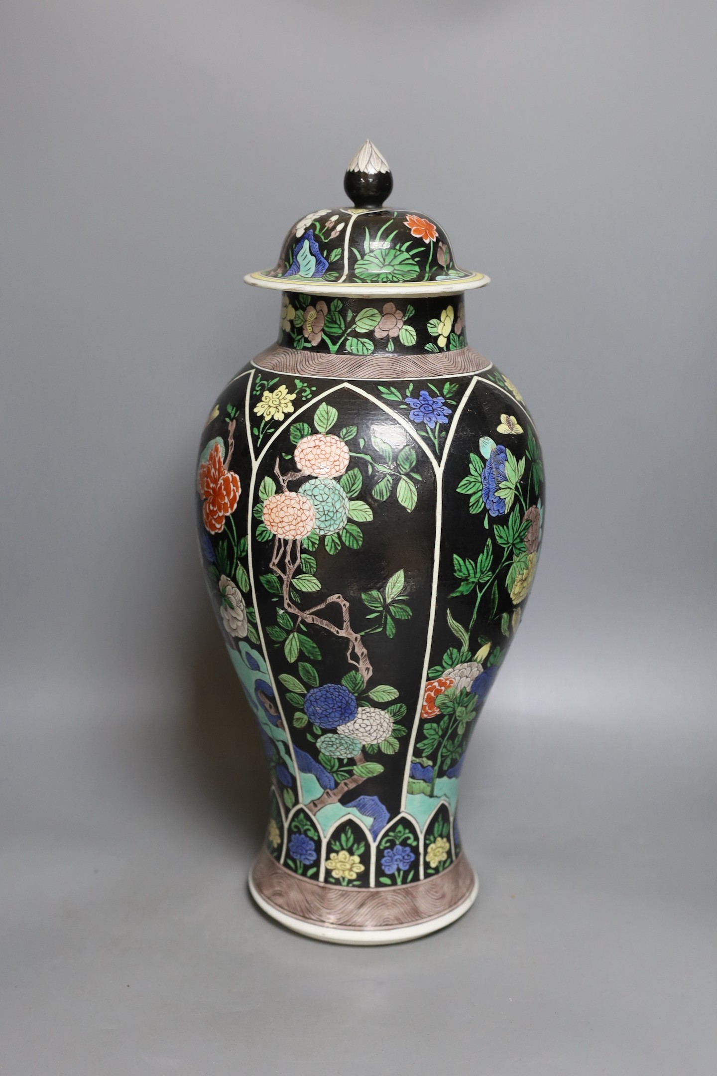 A late 19th century Chinese famille noire enamelled biscuit baluster vase and cover, 49cm high